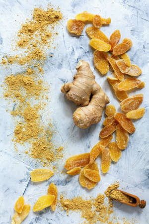 Ginger root, ground ginger and candied ginger on white stone background.の写真素材