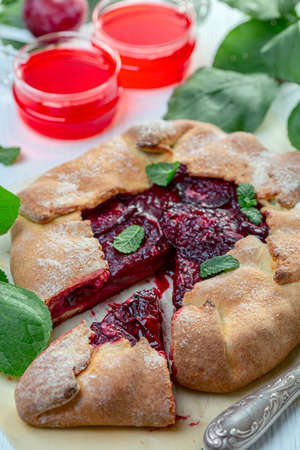 Artisanal vanilla ice cream in dark chocolate glaze served on a metal tray, selective focus.の写真素材