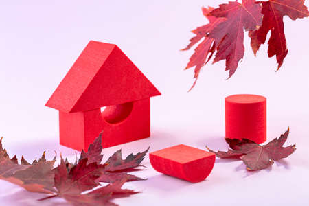 Christmas composition of snowy fir branches and red berries on a blue background. Winter festive nature concept. Flat lay, top view, copy space.の写真素材