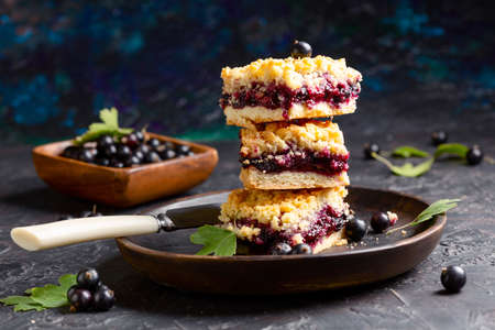 Cold green matcha tea mixed with ice cubes and milk on a wooden stand. Copy space. Concept of iced summer drinks.の写真素材
