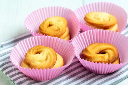 Homemade Danish butter cookies on a baking sheet, selective focus. Concept of homemade sweet...