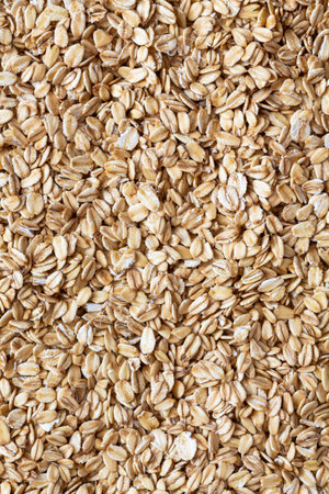 Close-up of whole rolled oats for healthy eating.の写真素材