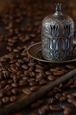 Traditional Turkish coffee set and coffee beans on a wooden table.の写真素材