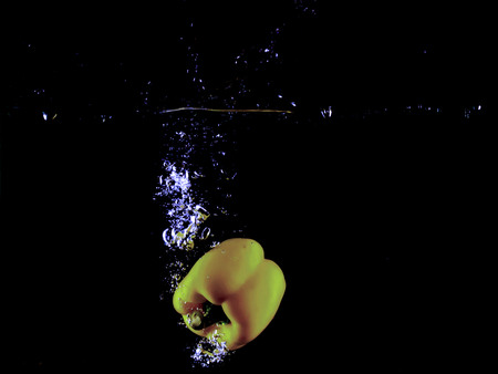 water splash isolated on dark background.の写真素材