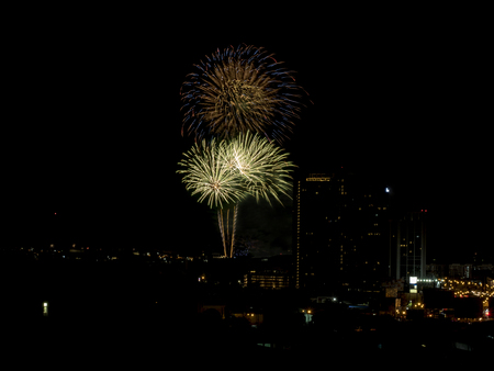 Colorful fireworks display over city . Firework celebration sparkling in midnight sky, countdown , khonkaen, Thailandの写真素材