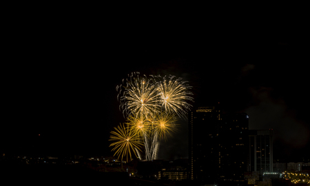 Colorful fireworks display over city . Firework celebration sparkling in midnight sky, countdown , khonkaen, Thailandの写真素材