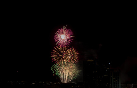 Colorful fireworks display over city . Firework celebration sparkling in midnight sky, countdown , khonkaen, Thailandの写真素材