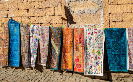 Handloom traditional and colorful clothes hanging Golden Fort of Jaisalmer, Rajasthan India with copy spaceのeditorial素材