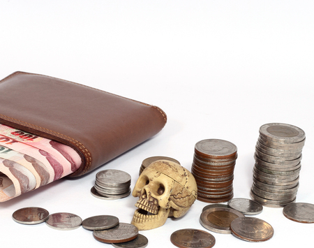 Purse with white background baht banknotes and coins.の写真素材