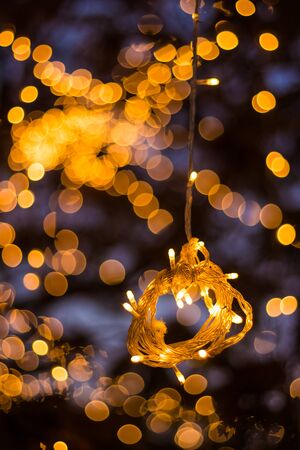 Bokeh Tree Light Decoration - Welcoming House and the fabulous party and Christmas night - Outdoor Trees have been decorated with yellow lightsの写真素材