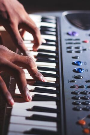 Music magician Playing the Electronic Keyboard in Music Recording studio close up on hands. Playing electronic Piano.の写真素材