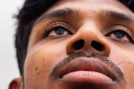 Patient showing his nose for Corona test - Corona virus / Covid-19 testing carried out by Doctor -...