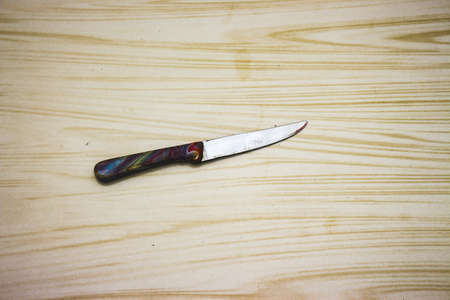 Kitchen knife on a Ceramic white floor background.の写真素材