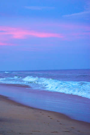 Beautiful beach view over the sunset colorful sky. Moving elements and wave photography from the beach in india. Dark blue sky in bay of bengal, Slow-shutter Sea Waves photography.の写真素材