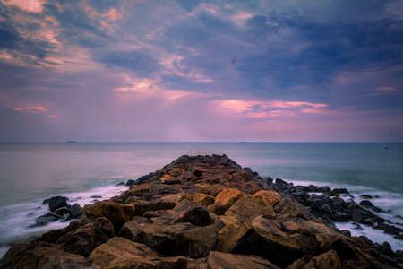 Beautiful sunrise over the beach in long exposure. Moving elements sunrise and wave photography from...