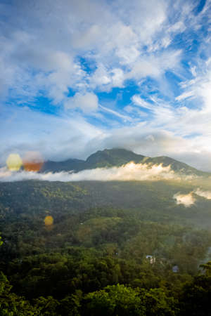 Beautiful mountain landscape with Sunrise and passing clouds. Munnar, Kerala, India
