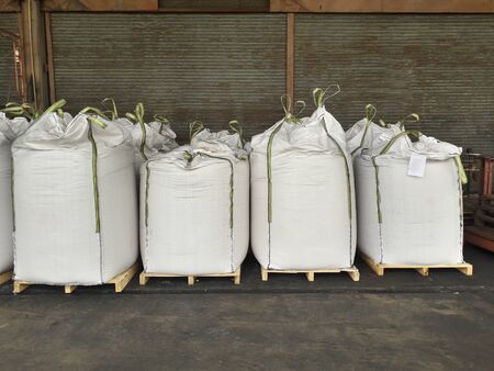 Chemical fertilizer Urea Stock pile jumbo-bag in warehouse waiting for shipment.