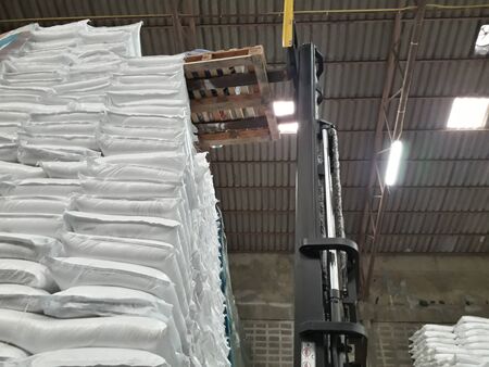 Chemical fertilizer The product stock is packed in sacks, stacked in the warehouse, waiting for delivery.の写真素材