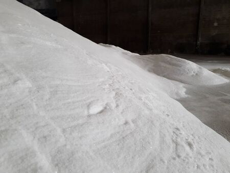 Bulk white urea fertilizer in warehouses waiting to be delivered to customers