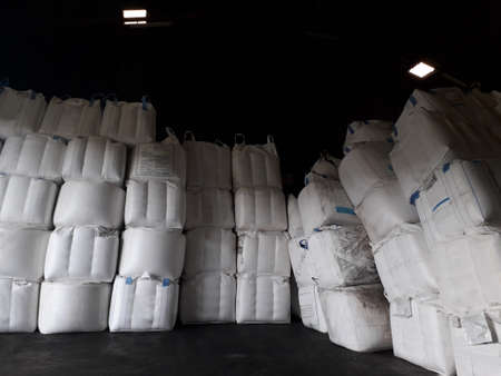 Chemical fertilizer Urea Stock pile jumbo-bag in warehouse waiting for shipment.