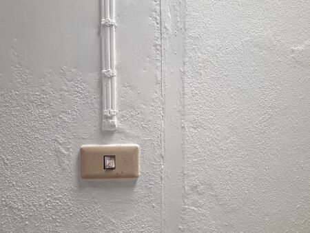 The cement wall background has a painted wire to give a new look to the white surface.