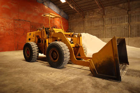 Orange loaders Large old and idle wheelsの写真素材