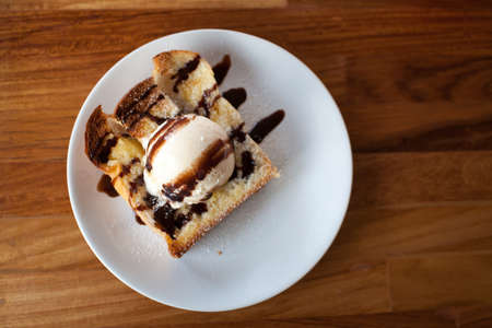 honey toast ice cream on a wood deskの写真素材
