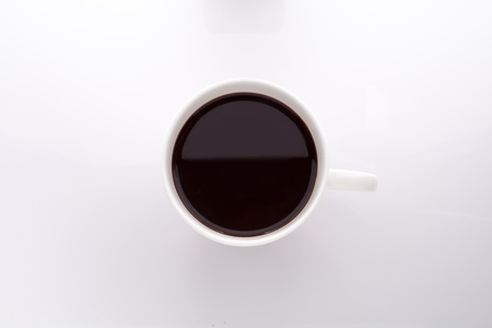 Top view of coffee cup isolated on whiteの写真素材