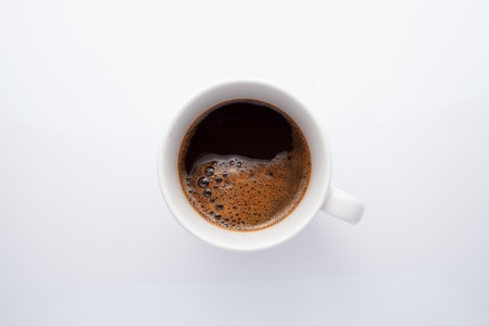 Top view of coffee cup isolated on whiteの写真素材