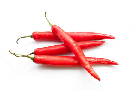 Red chili peppers isolated on the whiteの写真素材