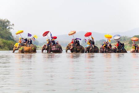 SUKHOTHAI - APRIL 7 : Sukhothai ordination parade on elephant back festival at Hadsiao Temple, Si Satchanalai from April 7 , Riding on elephant and Thai Puan elephant ordination on April 7, 2015 in Sukhothai.のeditorial素材