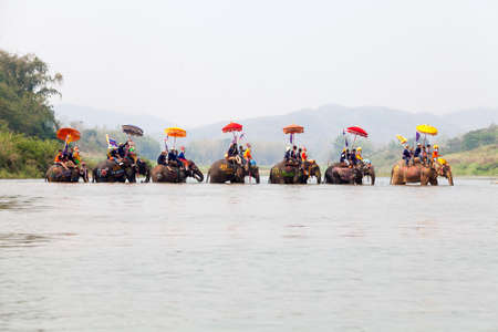 SUKHOTHAI - APRIL 7 : Sukhothai ordination parade on elephant back festival at Hadsiao Temple, Si Satchanalai from April 7 , Riding on elephant and Thai Puan elephant ordination on April 7, 2015 in Sukhothai.のeditorial素材