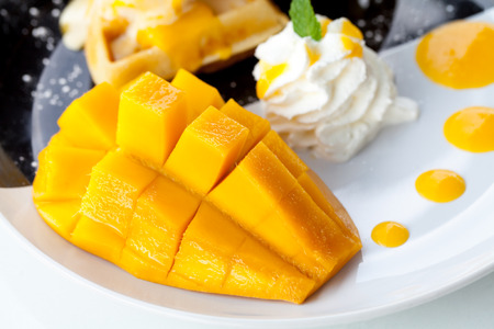 mango and waffles with ice creamの写真素材