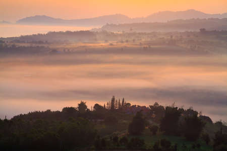 misty morning sunrise in mountain at Khao-kho Phetchabun,Thailandの写真素材