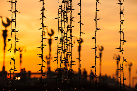 festive small lamps in evening backgroundの写真素材