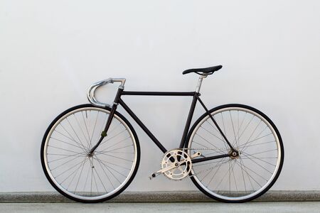City bicycle fixed gear and concrete wallの写真素材