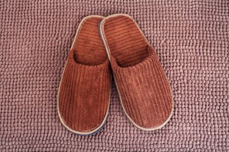 Brown wool slipper on matの写真素材