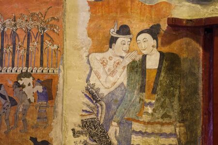 NAN, THAILAND - January 13,2013: Mural painting of a man whispering to the ear of a woman at Wat Phumin in Nan Province, Northern Thailand.のeditorial素材