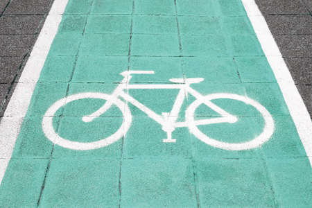 Bike lane and white bike symbolの写真素材