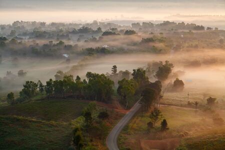 Misty morning sunrise in Khao Takhian Ngo View Point at Khao-kho Phetchabun,Thailandの写真素材