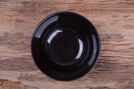 Empty bowl on woodの写真素材