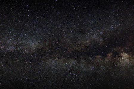 milky way galaxy on a night sky, long exposure photograph, with grain.の写真素材