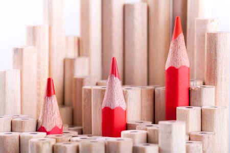 three sharpened red pencil among many onesの写真素材