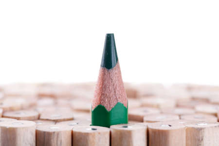 One sharpened green pencil among many onesの写真素材