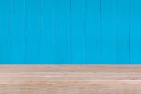 Wood table top on blue wood backgroundの写真素材