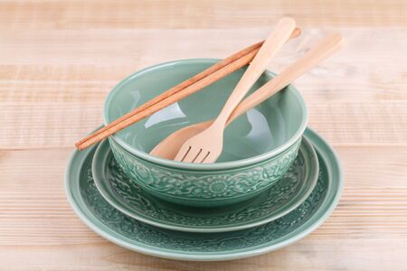 Empty caramic celadon dish with bowl and spoon forkの写真素材