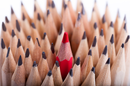 One sharpened red pencil among many onesの写真素材