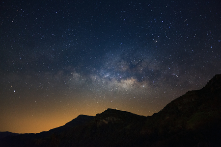 Milky way galaxy with stars over moutain, Long exposure photograph, with grain.の写真素材