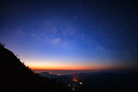Landscape sunrise and Milky way galaxy at Doi inthanon Chiang mai, Thailand.Long exposure photograph.With grainの写真素材
