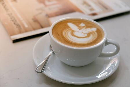 Coffee latte art in coffee shop in vintage color filter